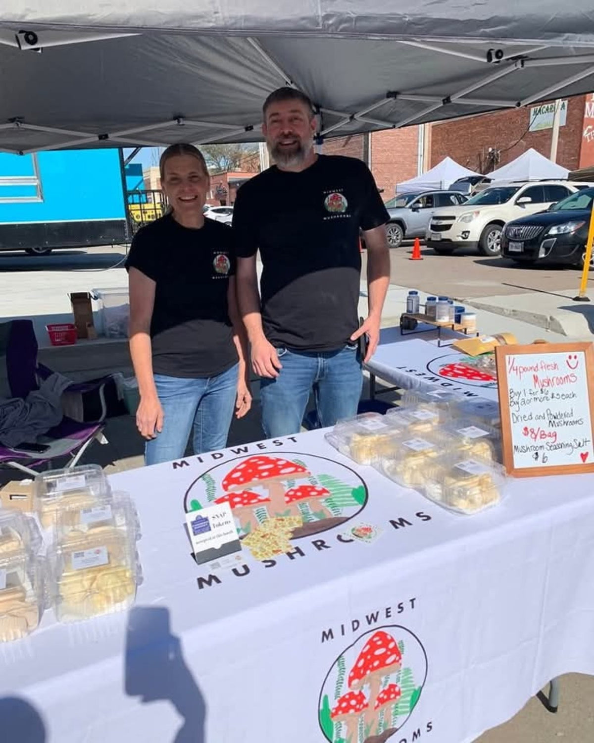 Brian and Selena Ickler at the Midwest Mushrooms stand at Norfolk Farmers Market